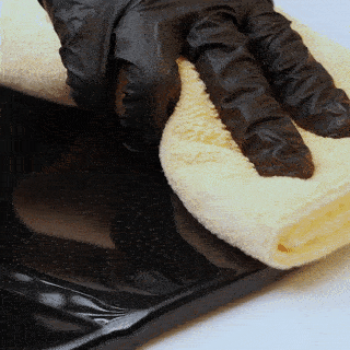 a person holding a piece of cheese